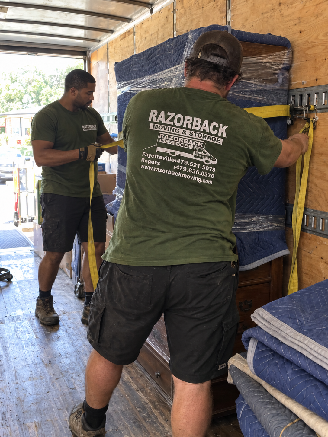 Razorback movers securing furniture inside a moving truck