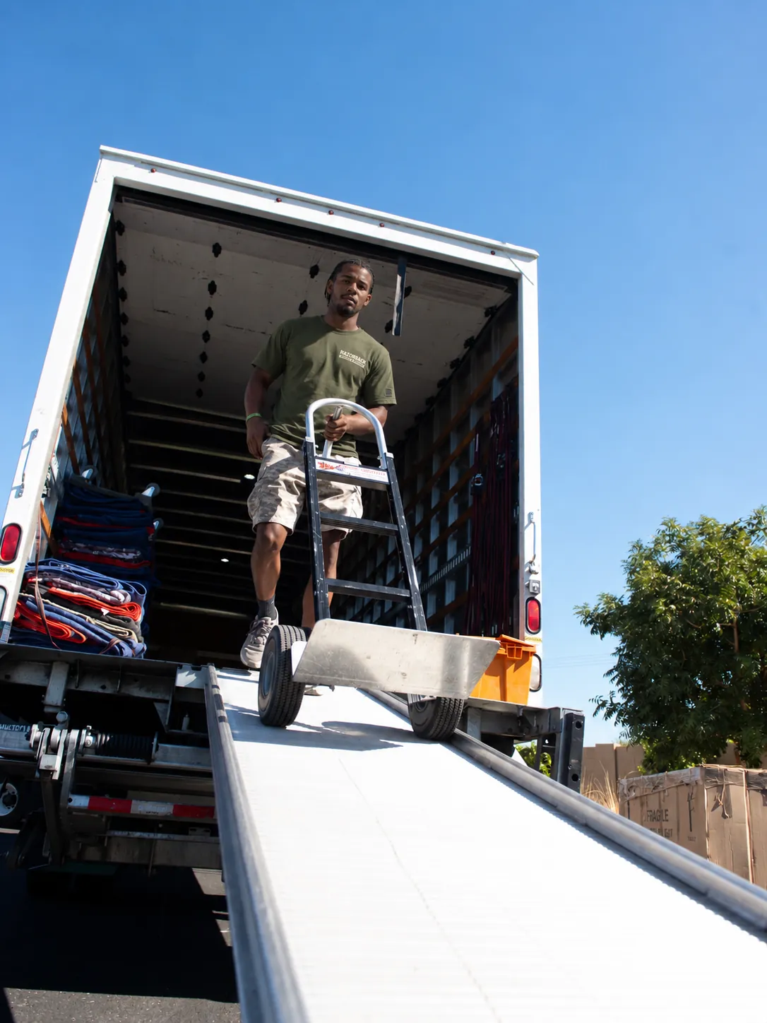 Razorback mover using a hand truck on a ramp