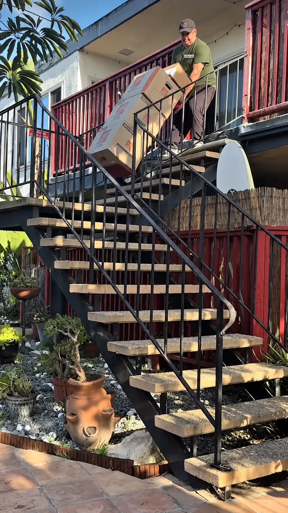 Razorback mover handling boxes on stairs